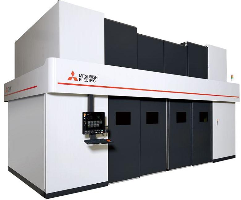 A white enclosed laser cutting system is shown.