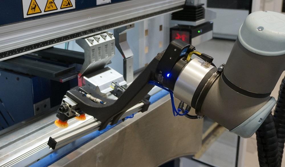 Cobot on press brake in a metal fabrication shop