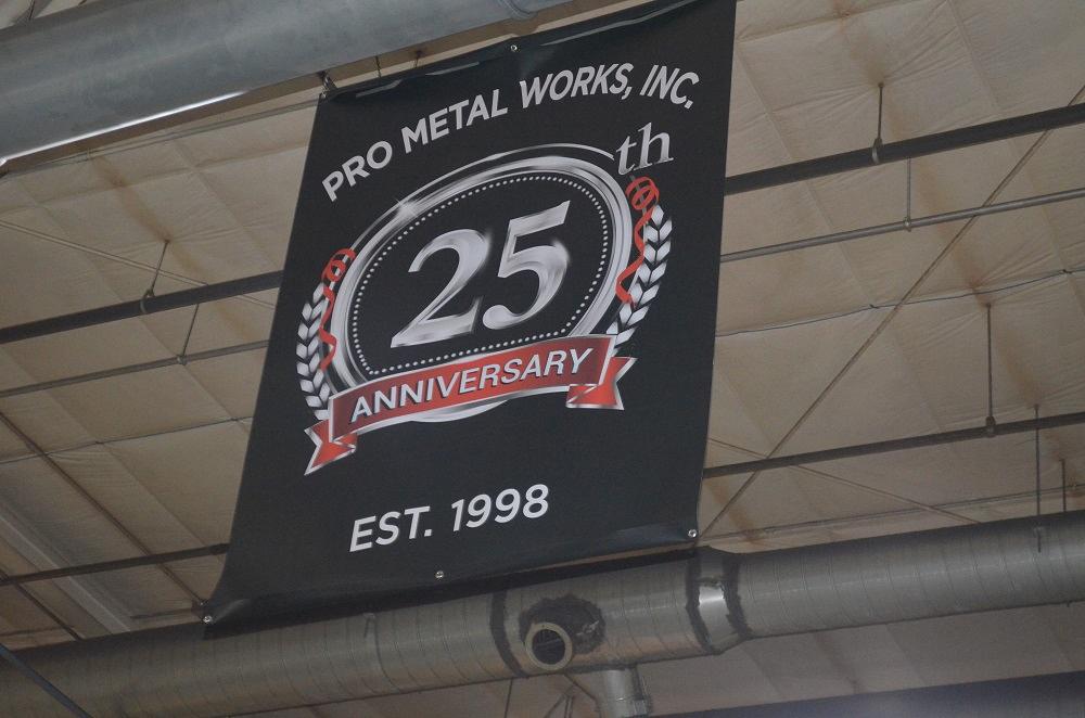 A 25th anniversary banner hangs from the ceiling.