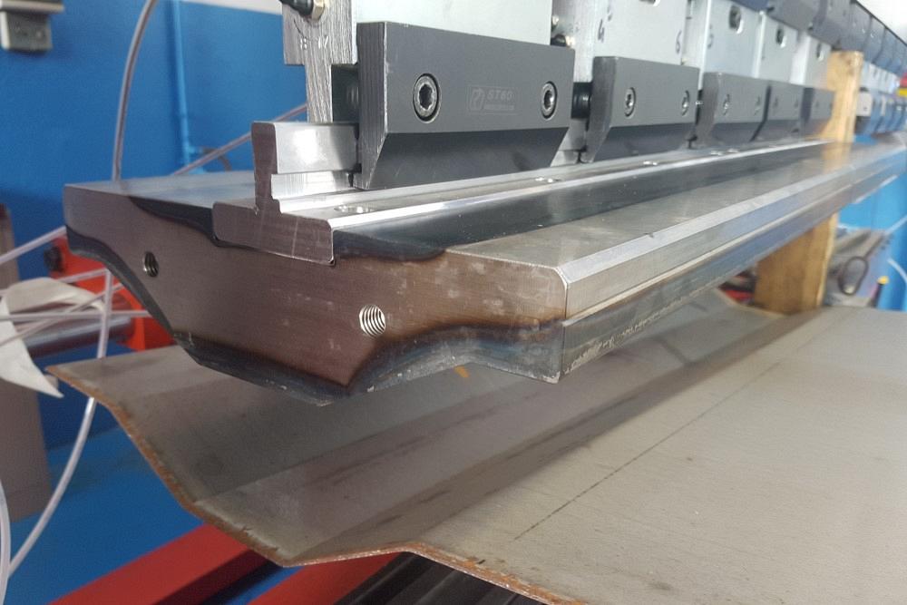 Custom press brake tooling can assist in creating complicated forms, such as this large omega shape.