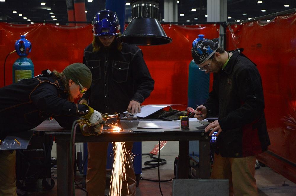 A SkillsUSA team works on a fabrication project.