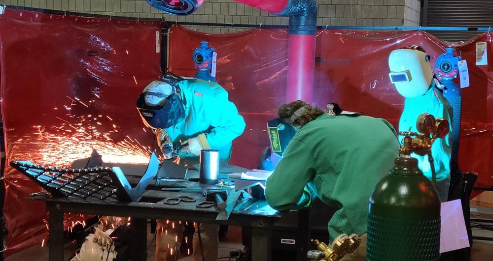 A team works on a welding fabrication project.