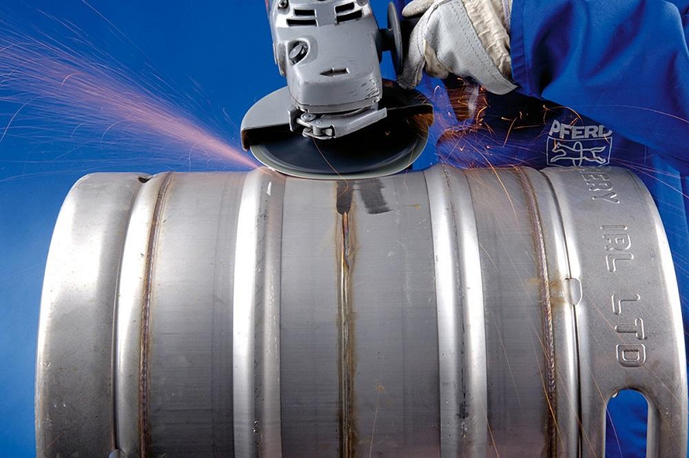 A power tool is used to remove a weld from an aluminum keg.