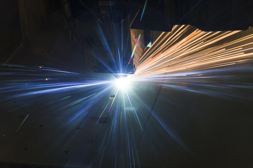 A laser cuts sheet metal.