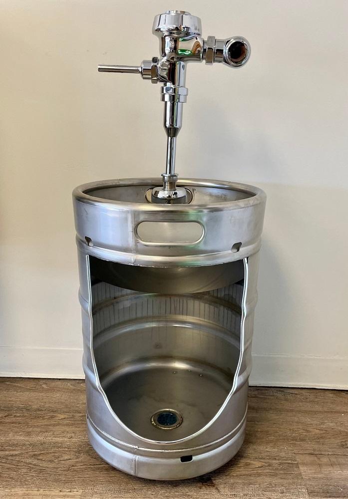 This urinal is made from a stainless steel keg.
