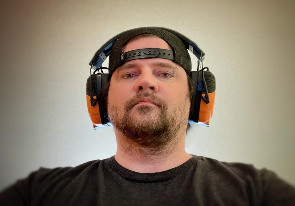 Josh Welton wearing Isotunes Link headphones