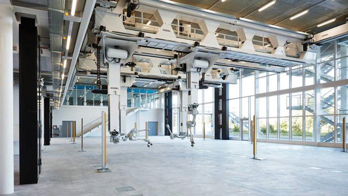 Ceiling-mounted linear module saves floor space for part transport