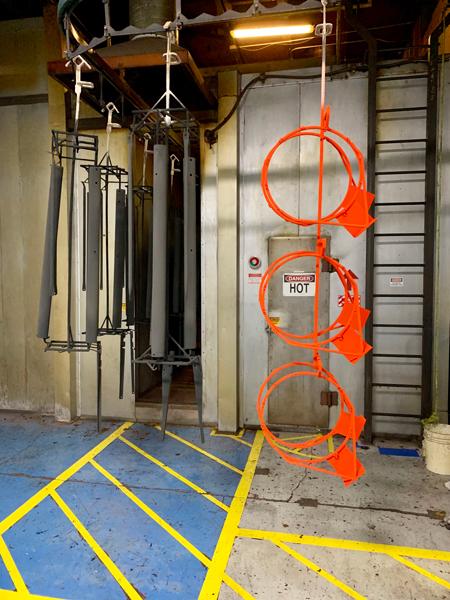 Clever racking design boosts lifelong powder coating coverage