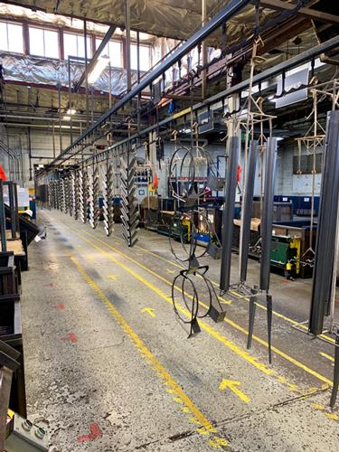 Clever racking design boosts lifelong powder coating coverage