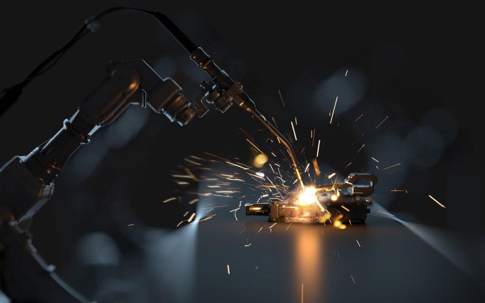 Robotic arm welding in a metal fabrication shop