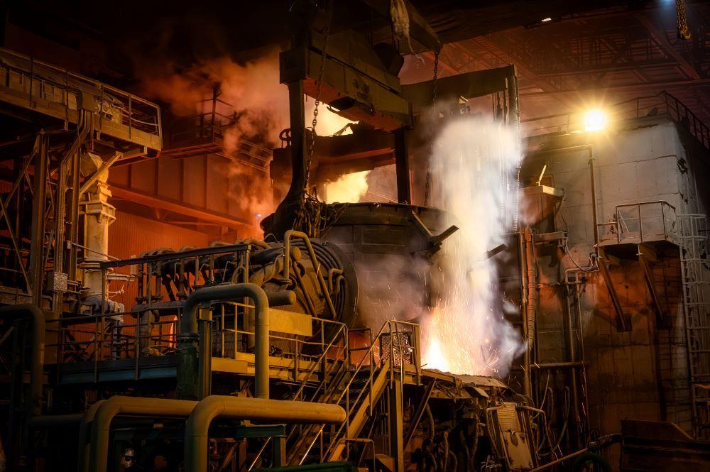 Scrap is loaded into an electric arc furnace. 