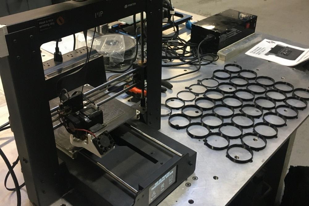 3D printer producing PPE to prevent spread of COVID-19