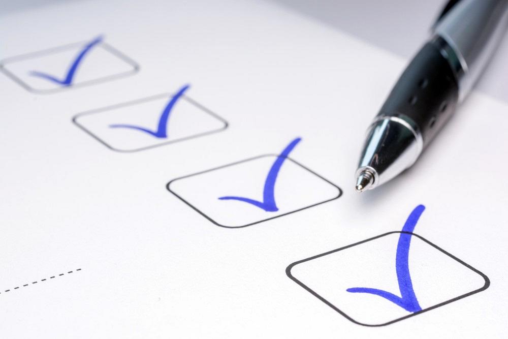 Checklist with blue pen