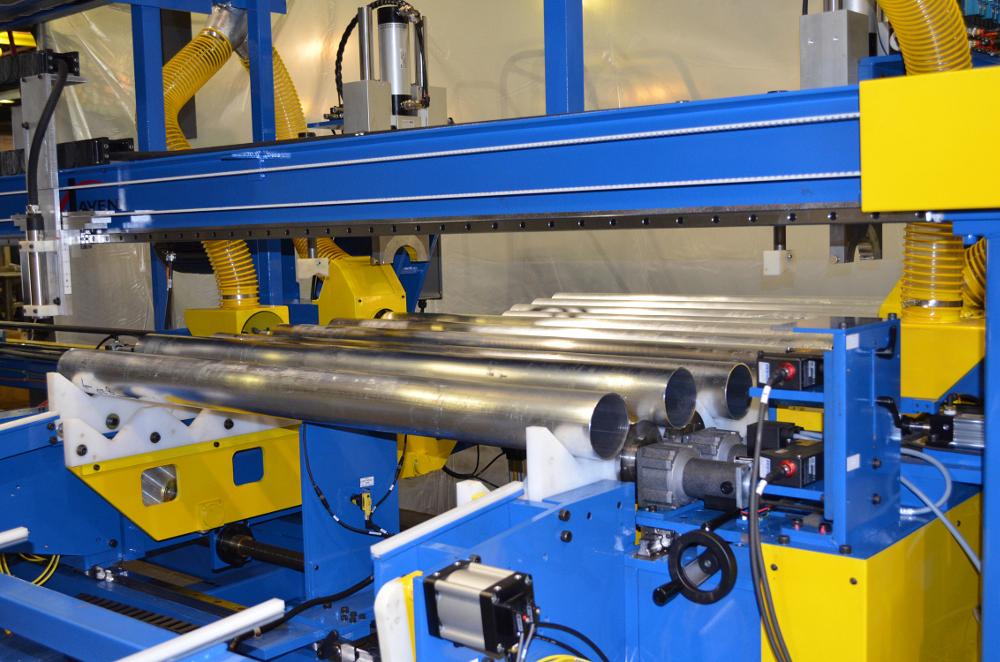 End finishing/inspection machine has seven stations working simultaneously