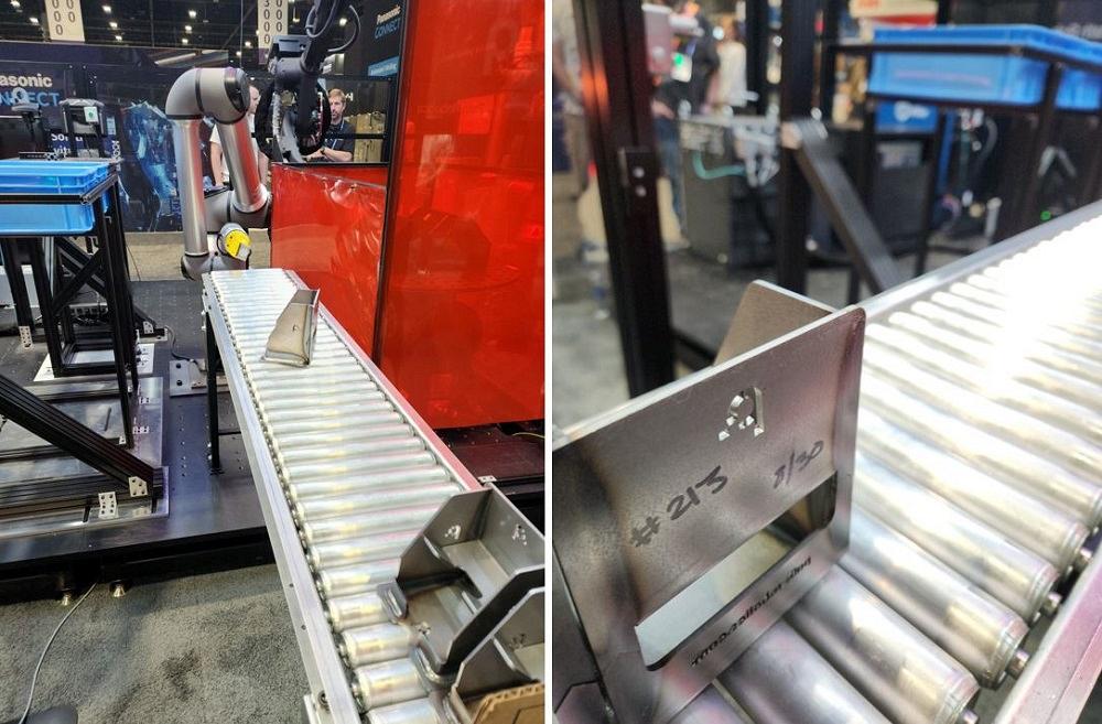Robots place metal parts on a conveyor.