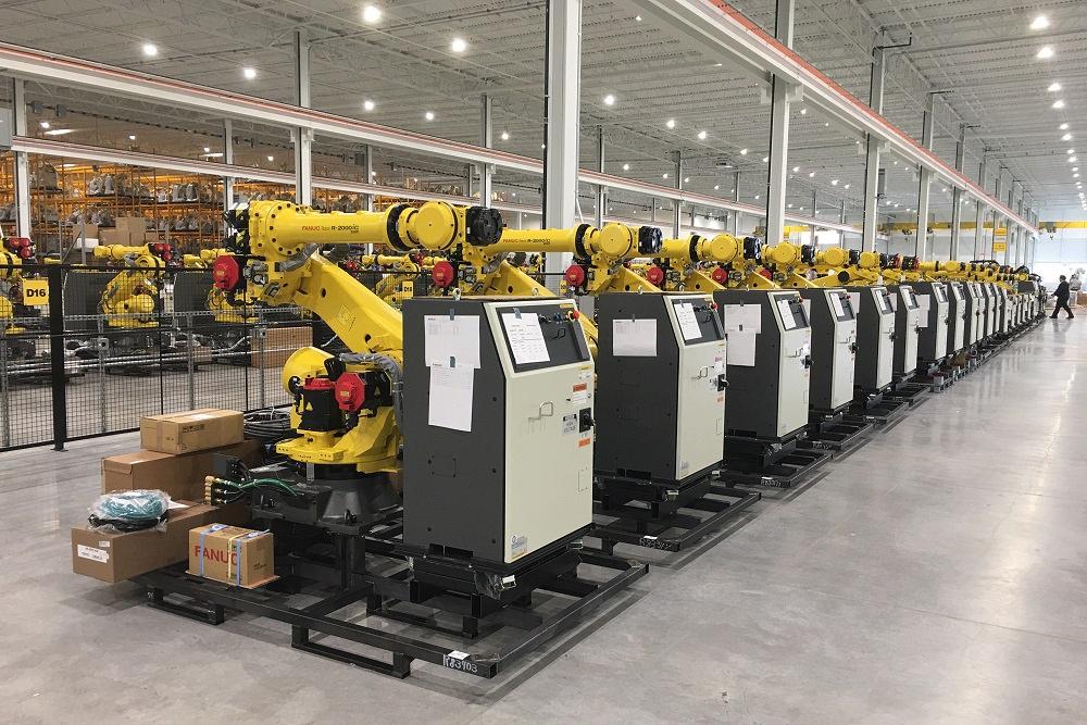 FANUC robots are lined up for shipping.