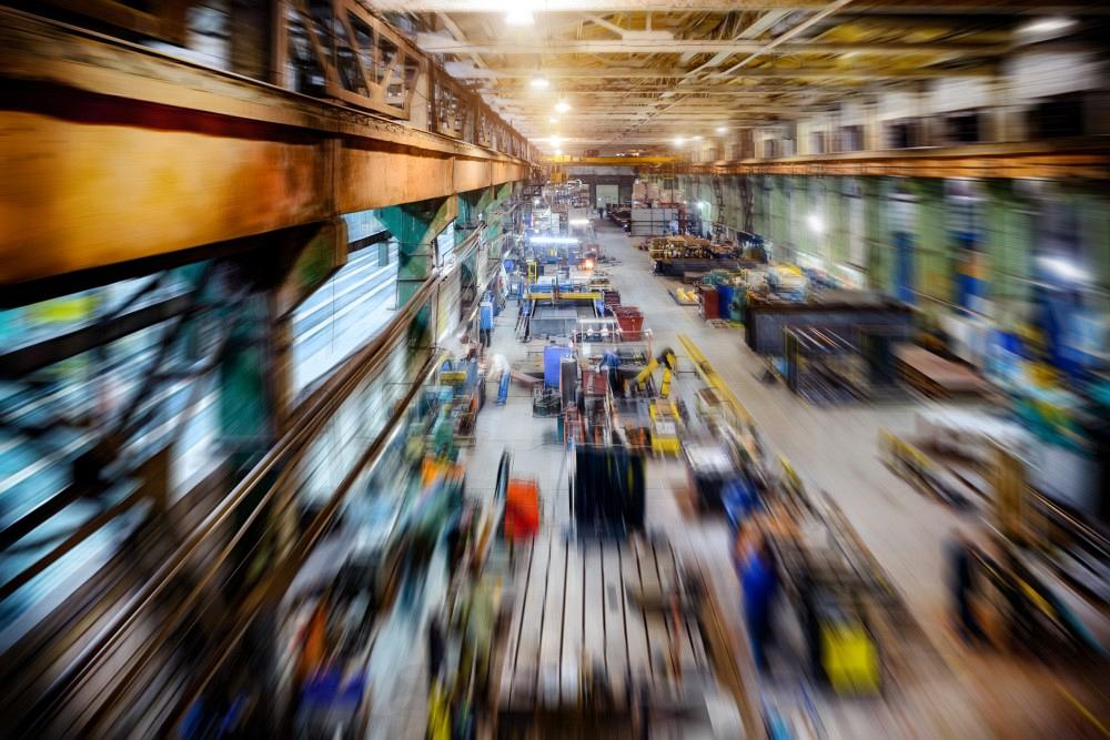 Factory shop, view from the top point. Abstract industrial background, motion blur effect.