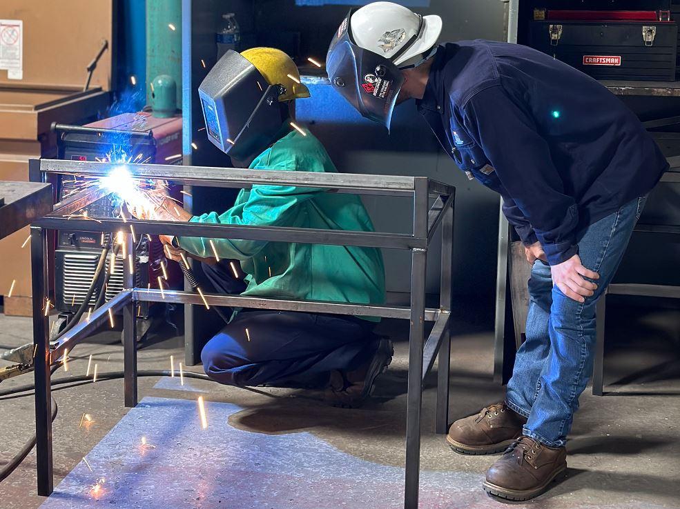 A welder works on a fabrication.