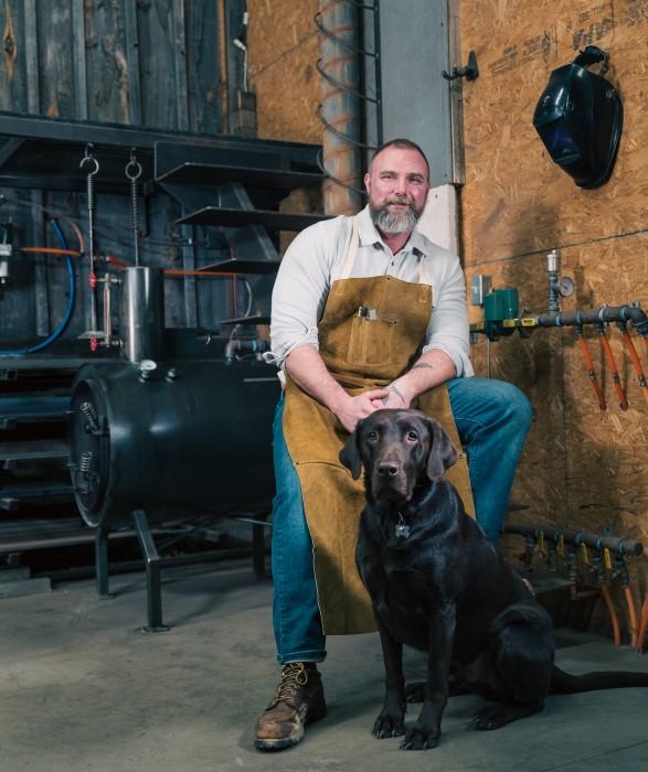 Metal fabricator and his dog