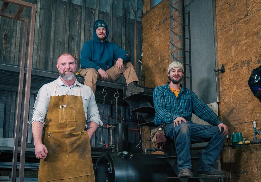 Blue Barn metal fabrication shop workers