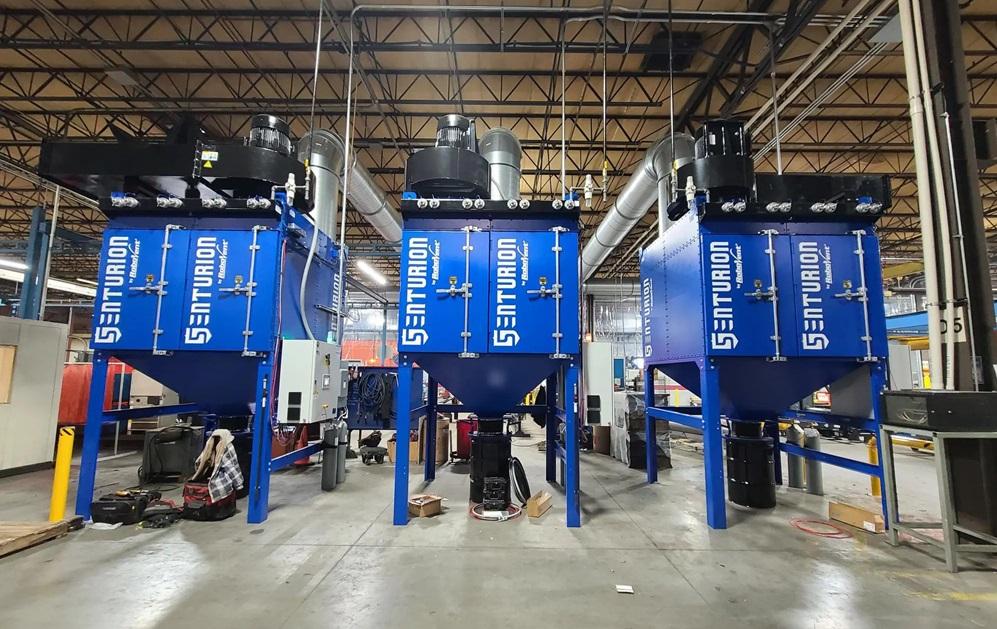 A bank of cartridge dust collectors at a fabrication shop.