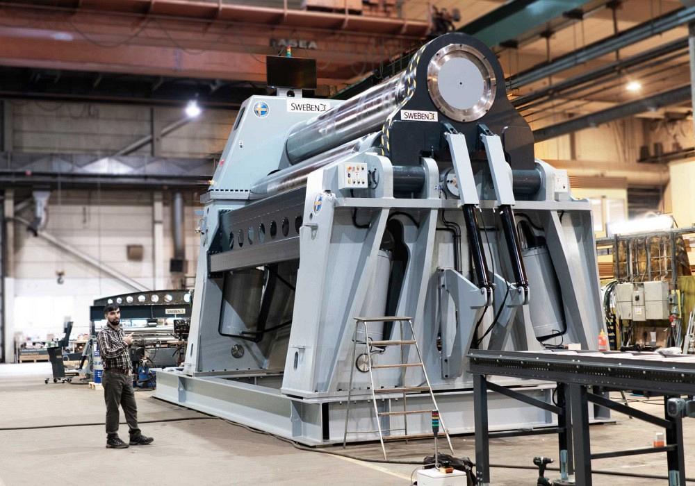 Plate rolling machines in a metalworking facility