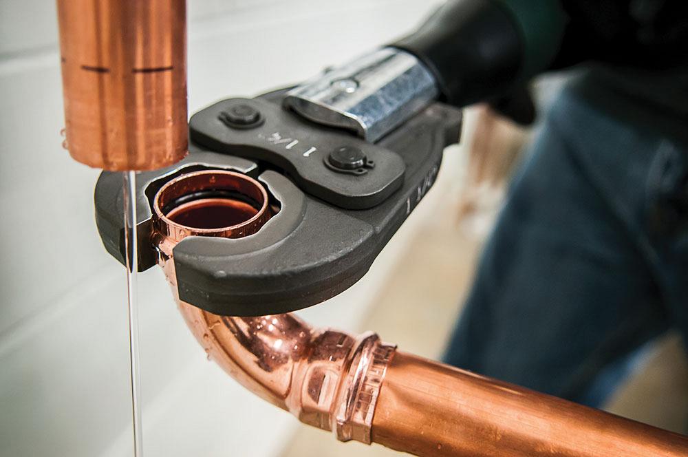 Hand-held pressing tool provides quick, convenient pipe installation ...