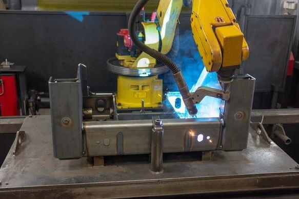 A welding robot is shown.