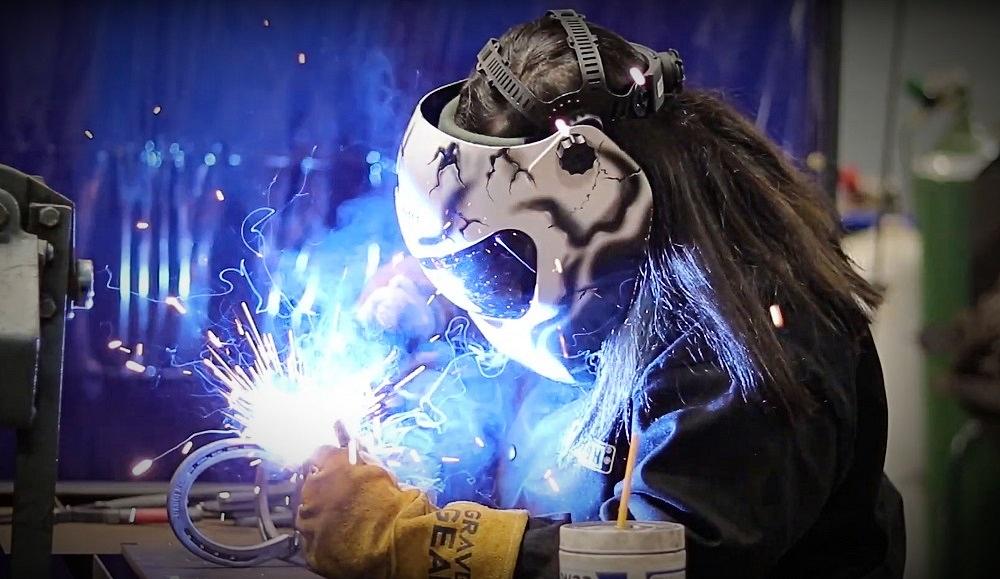 Dickinson High School welding student welds a horseshoe pumpkin