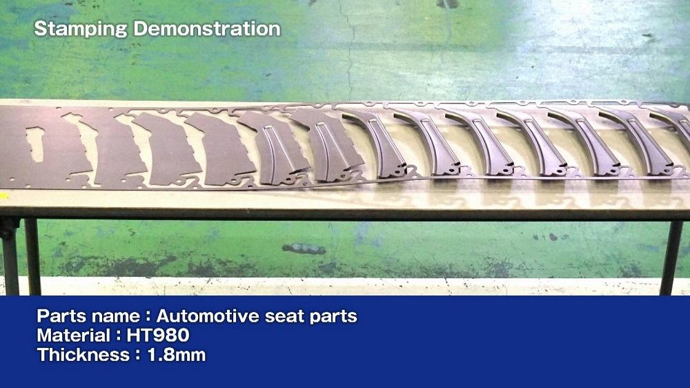 automotive seat part is formed from a progressive die strip in servo press