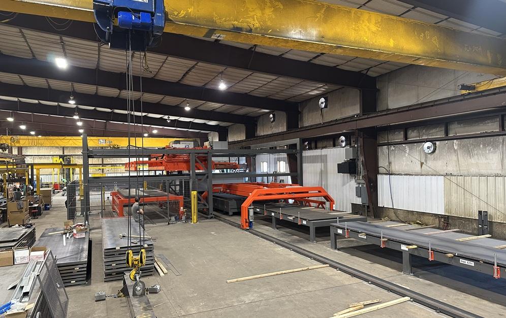 Metal fabricating machine sits on a factory floor.