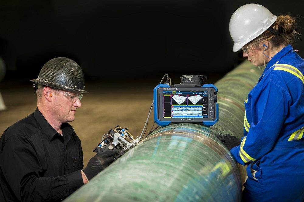 Inspecting the weld to ensure quality
