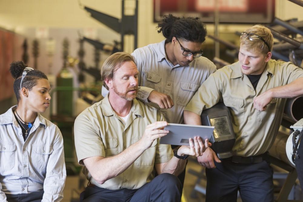 Welding instructor teaches at a trade school 