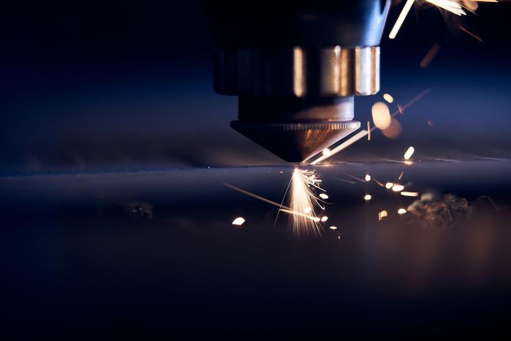 CNC Laser cutting of metal close up, modern industrial technology.