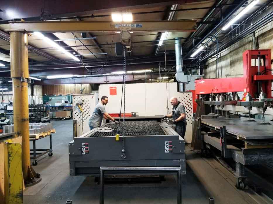 Operators sort laser cut parts