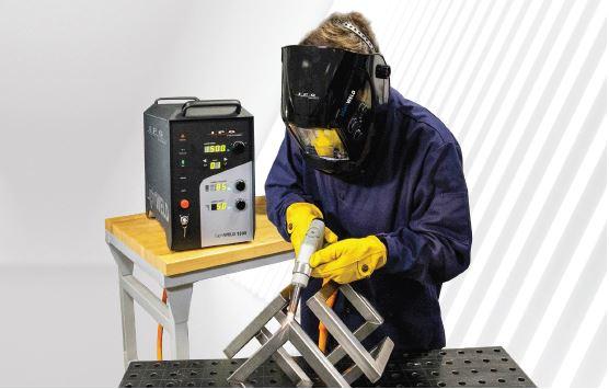 A welder uses the LightWELD hand-held laser welding system from IPG Photonics.