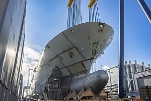 A ship sits on a shipyard.