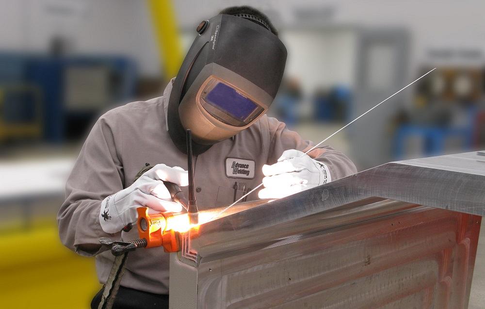 A person TIG welds.