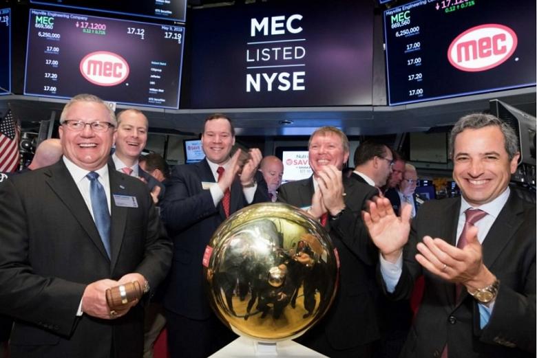 MEC celebrates after ringing the opening bell at NYSE