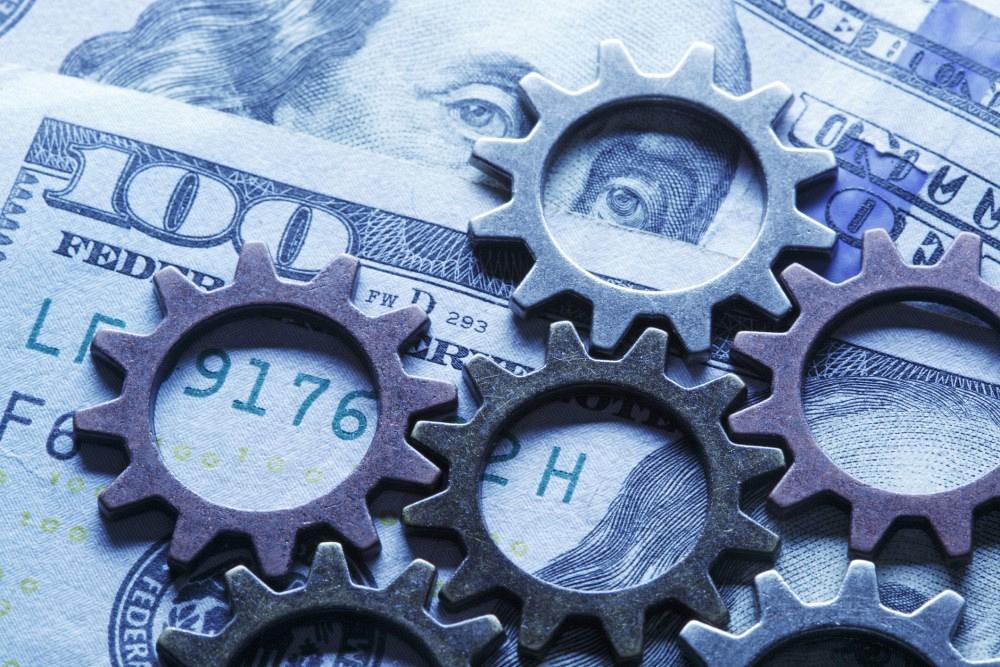 Hình minh họa tiền với bánh răng sản xuất