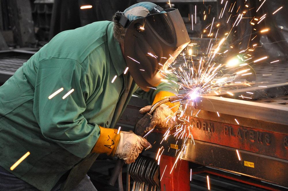 A welder produces sparks.