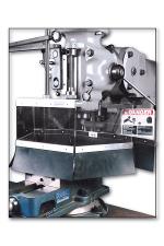 Milling machine shield protects operators from flying chips, sparks