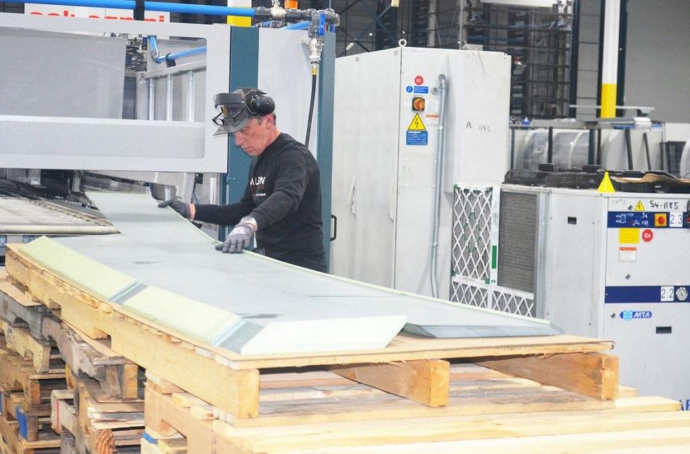 Material is removed form a panel bending machine.