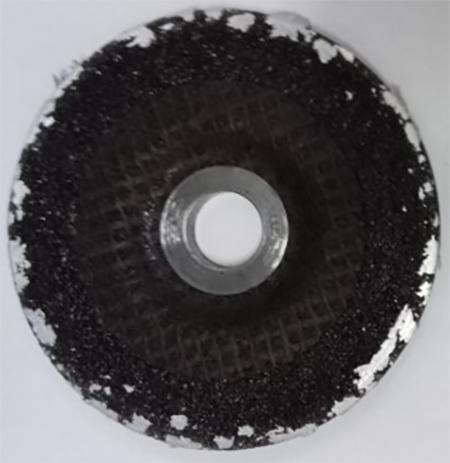 A standard grinding wheel with aluminum loaded zones is shown.