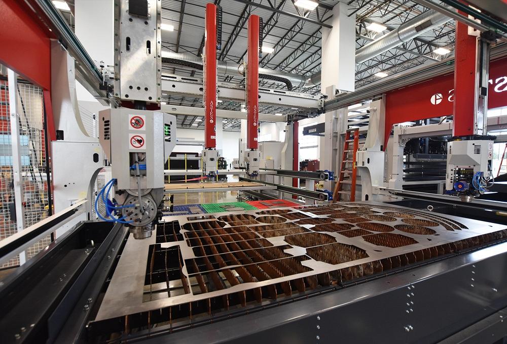 A machine moves metal parts.