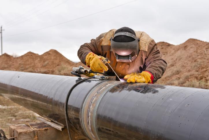 Welder works on a pipeline.