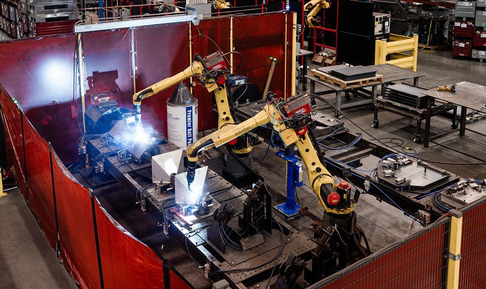 welding robots in a metal fabrication shop