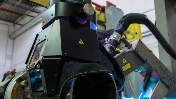 An arc hood on a pipe welding collaborative robot or cobot
