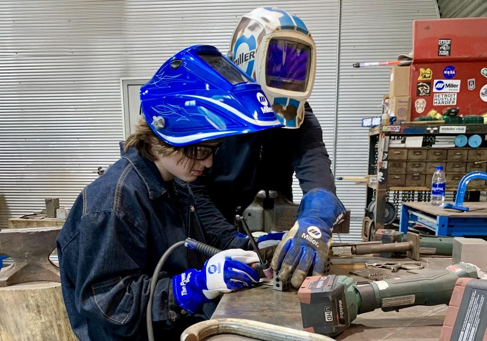 Welding student and welding instructor