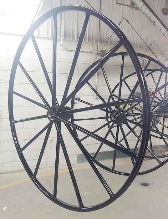 A metal carriage wheel 